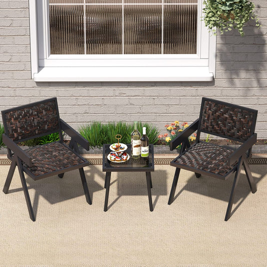 Brown patio furniture set with two chairs and a table on a paved patio