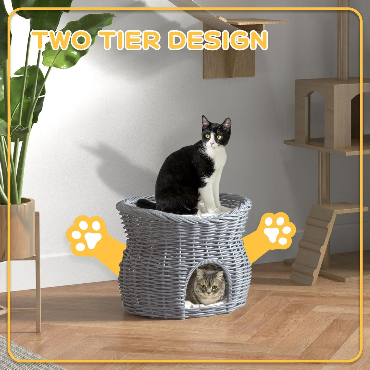 The two tier wicker cat house with two cats enjoying the levels