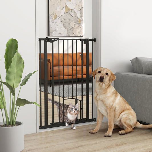 A black metal dog safety gate with a cat flap installed in a doorway with a dog and a cat