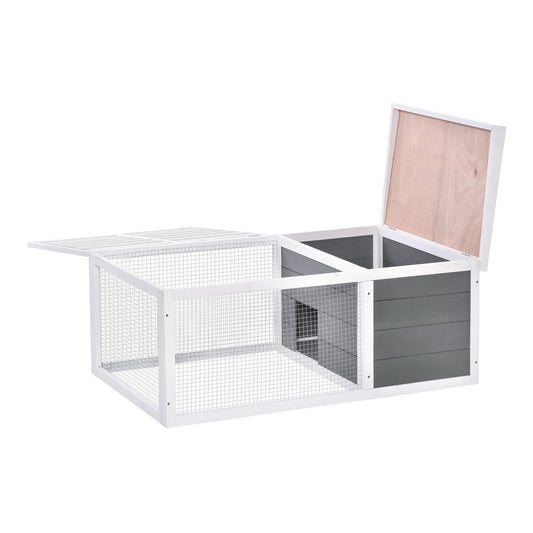 The guinea pigs hutch with the wooden roof and wire mesh lid opened upwards