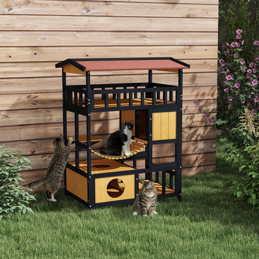 This outdoor cat house is shown in a garden setting with two cats interacting with it