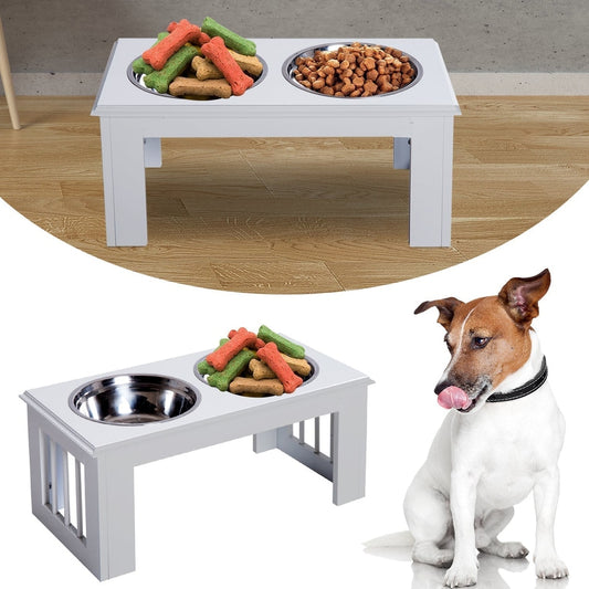 The white wooden dog bowl stand with two stainless steel bowls filled with dog treats