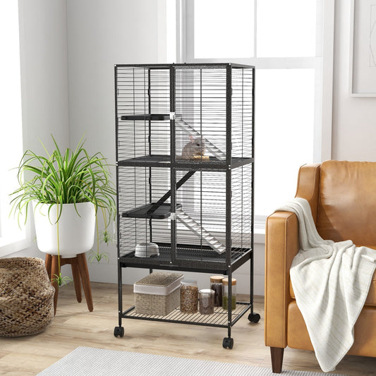 The small animal cage in a living room with a sofa and plant