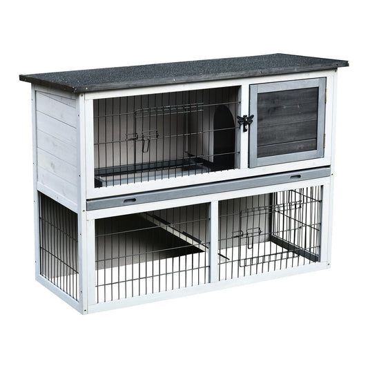 A grey and white two-tier guinea pigs hutch with a wooden door on the upper level