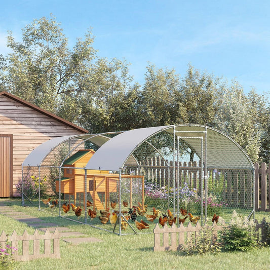 This large walk-in chicken coop is set up in a garden with chickens inside