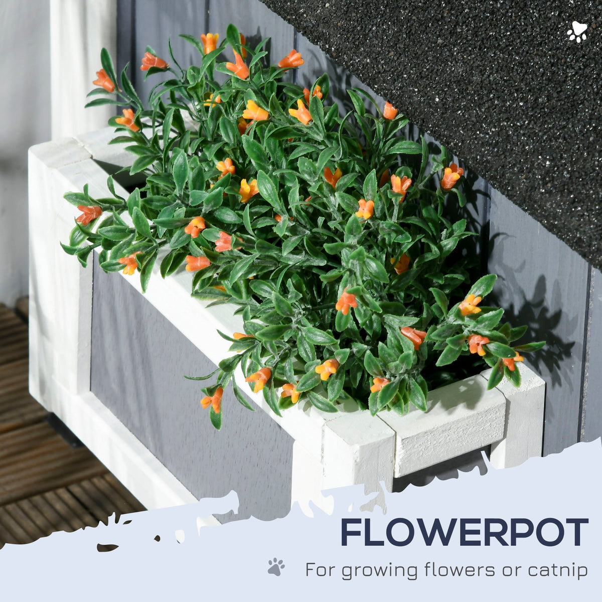 Close-up of the planter box on the grey wooden cat house filled with green plants and orange flowers