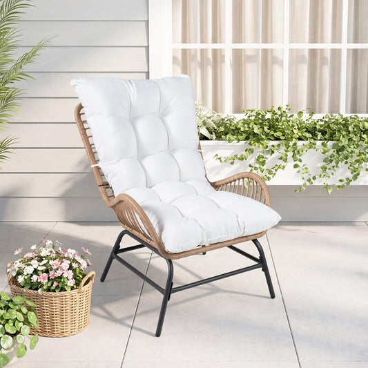 The PE Rattan Leisure Chair with cushion on a patio next to a window