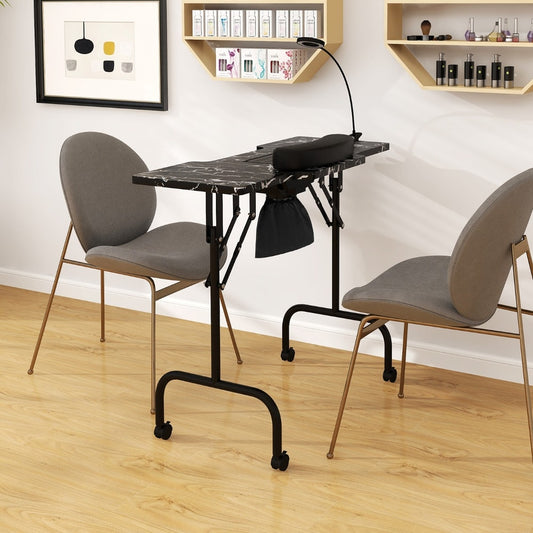 The spa and salon table is set up in a room between two chairs, showing its portability