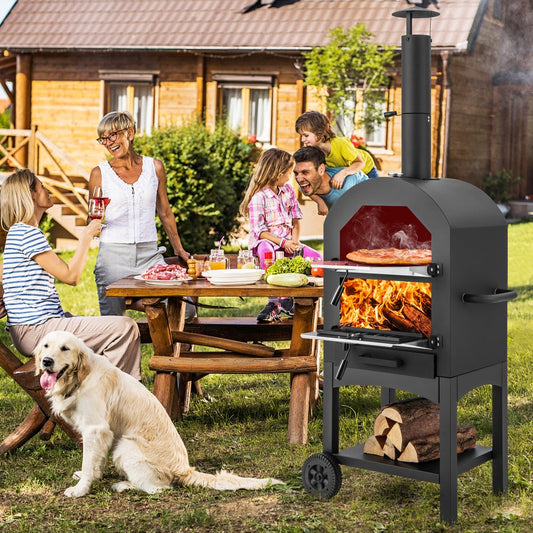 Family enjoying a pizza cooked in the outdoor grill at a garden party