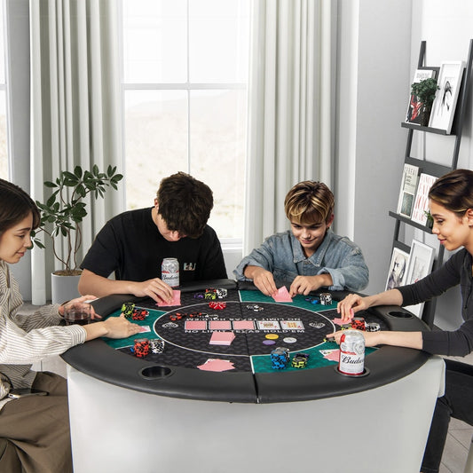 The round blackjack board game mat in use with four people playing cards and chips around a table