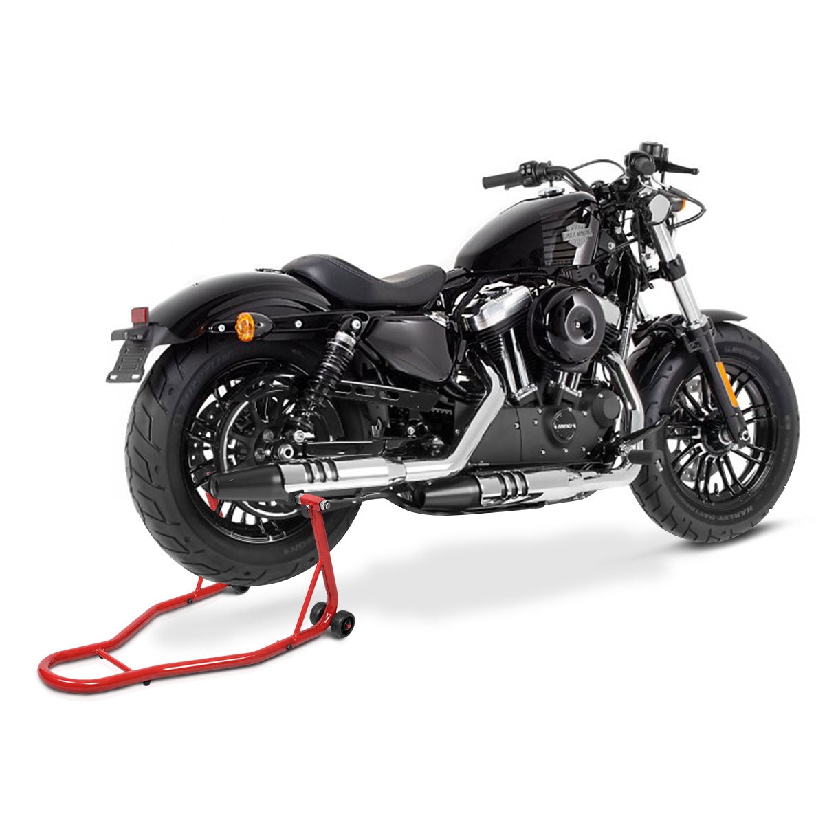 A black motorcycle is supported by a red rear wheel lift stand on a paved surface