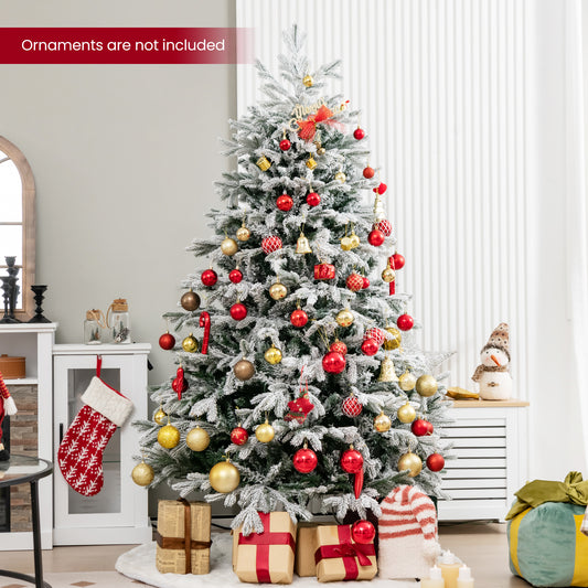 The Christmas tree decorated with red and gold baubles in a living room