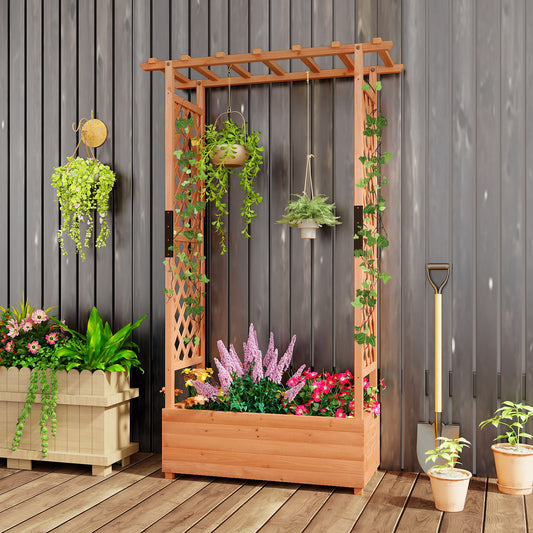 The wooden planter box with trellis is filled with flowers and hanging plants