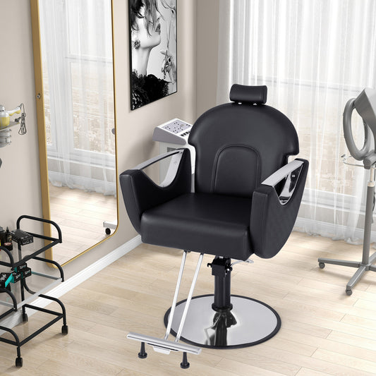 Black reclining salon chair for hair stylists set up in a salon room next to a mirror