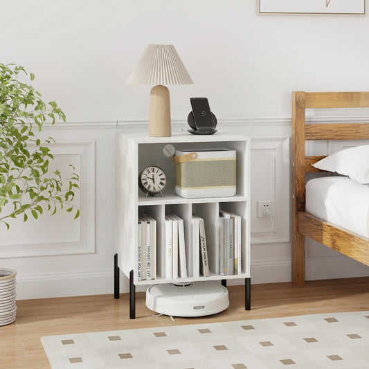 Record Player Stand, the end table placed in a bedroom next to a bed with a lamp and a wireless charger on top