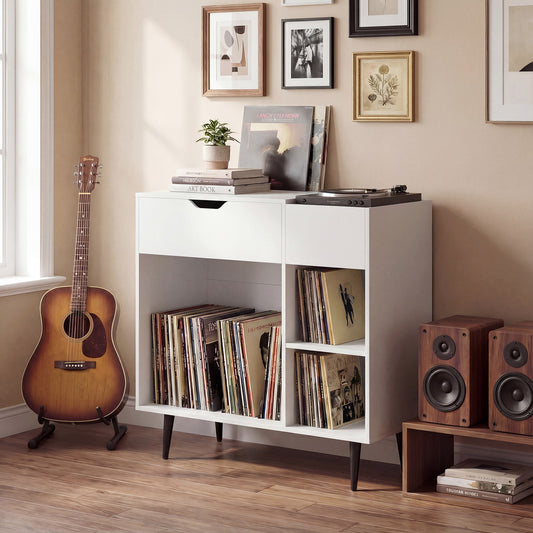 The white record player stand is shown in a room with a record player on top and records stored inside