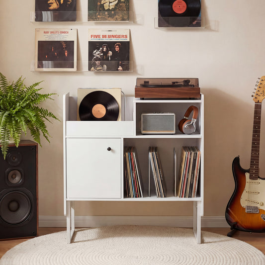 The side table styled in a living room with a record player and guitar nearby