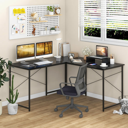 The corner study workstation and writing desk in a home office setting with a chair and plants