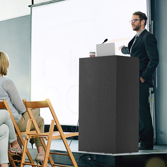 The black lectern being used by a man giving a presentation in a meeting room