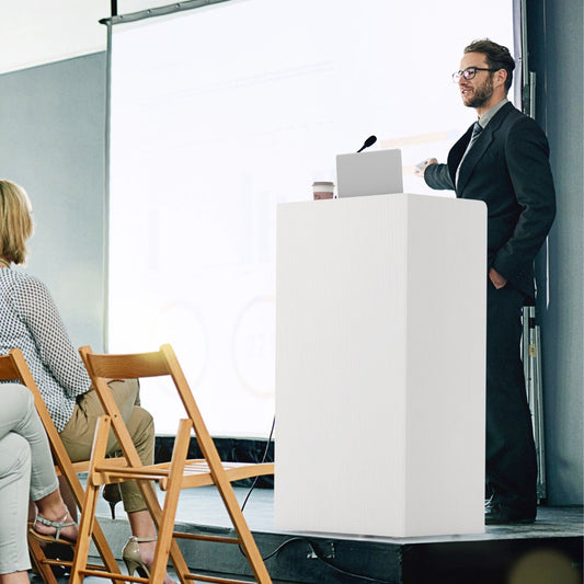The white lectern stand is used by a speaker at a presentation