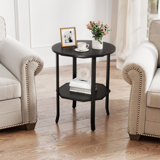 The black two-tier end table is placed between two armchairs in a living room setting