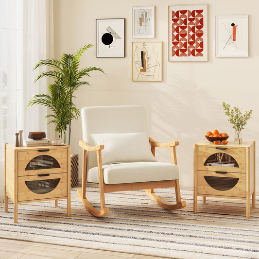 The bedside tables placed on either side of a rocking chair in a bright living room setting