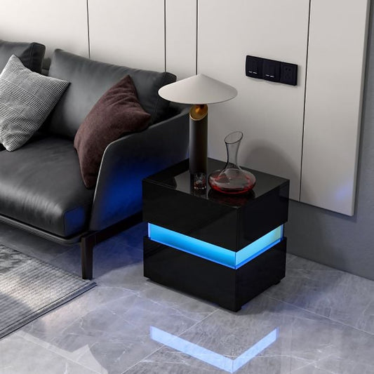 Black bedside table with blue LED lighting next to a sofa