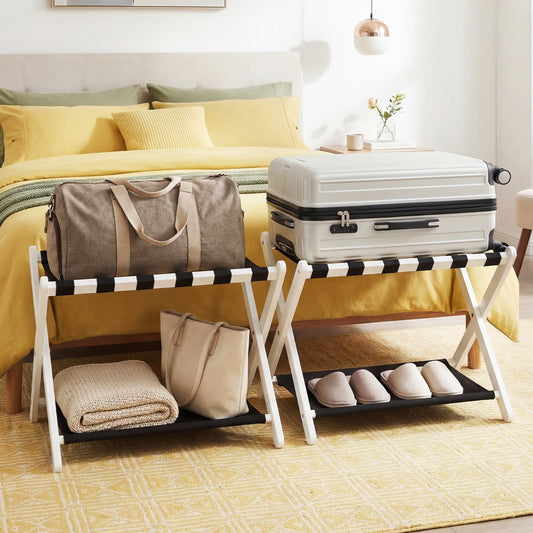 Two folding luggage racks in a bedroom, one holding a suitcase and bag, the other holding slippers