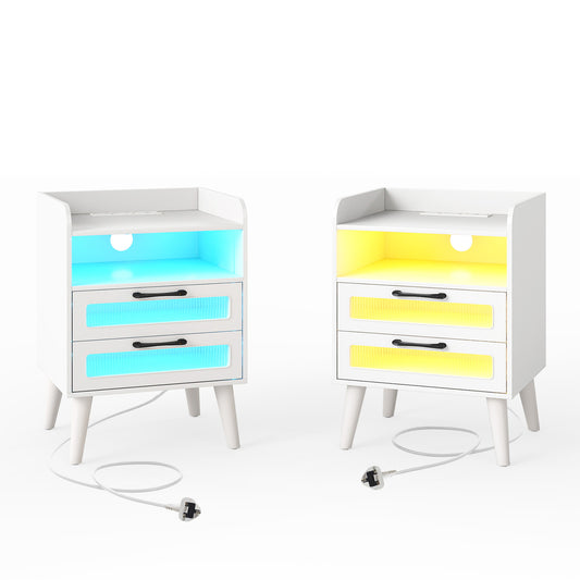 The white bedside tables with empty shelves and glowing blue and yellow LED drawer fronts
