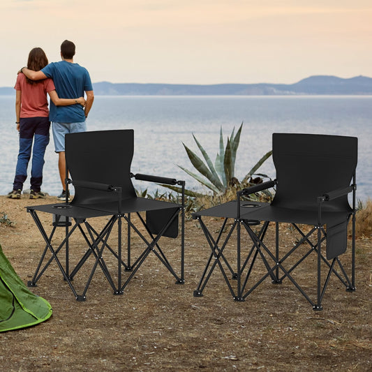 The camping furniture placed on a cliff edge overlooking the sea with a couple standing nearby
