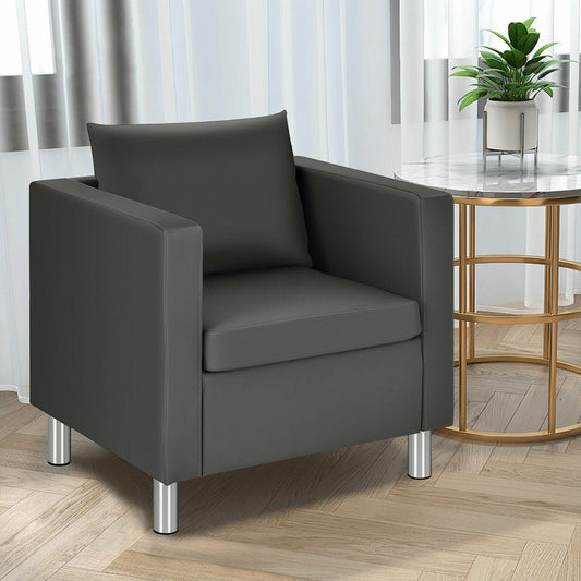 dark grey PU leather accent tub chair with pillow placed in a bright living room setting next to a marble side table
