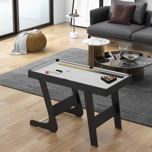 The folding pool table in a modern living room setting on a grey rug