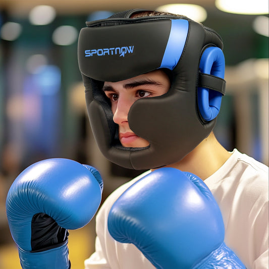 A man wearing the blue and black boxing headguard and blue boxing gloves