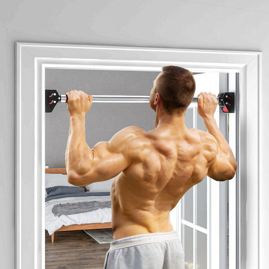 A muscular man performing a pull-up exercise using the doorway pull-up bar