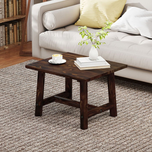 The square side table in a living room setting, placed on a rug next to a sofa