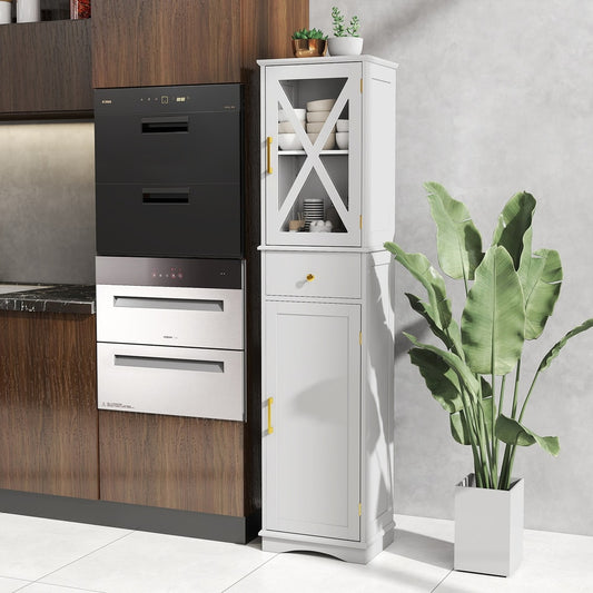 The white floor cabinet standing next to kitchen appliances and a large plant