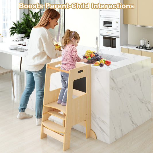 A mother and child using the kitchen step stool together at a counter