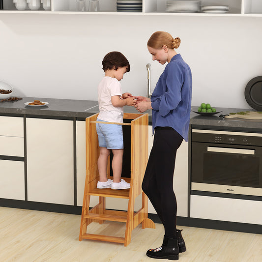 The kitchen stool being used by a toddler standing at a counter next to an adult in a kitchen