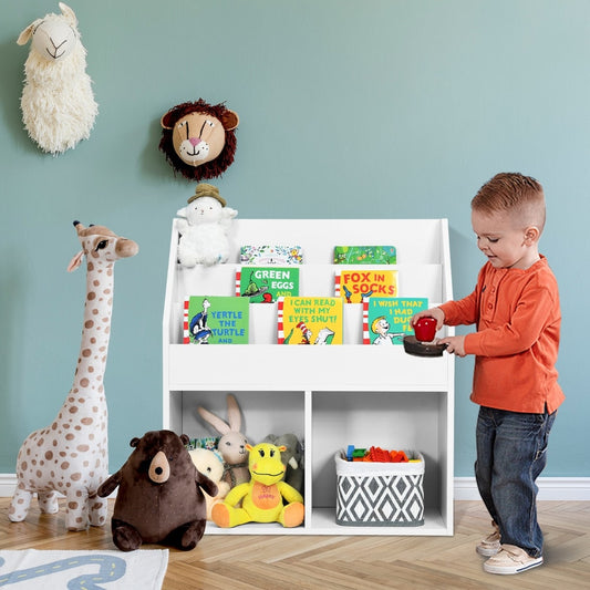 A young boy plays with a toy storage cabinet organizer filled with books and stuffed animals