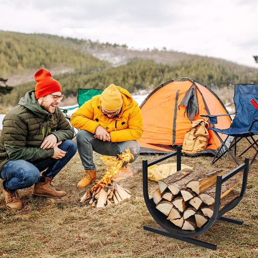 The log storage filled with firewood sitting on the grass next to two men by a campfire