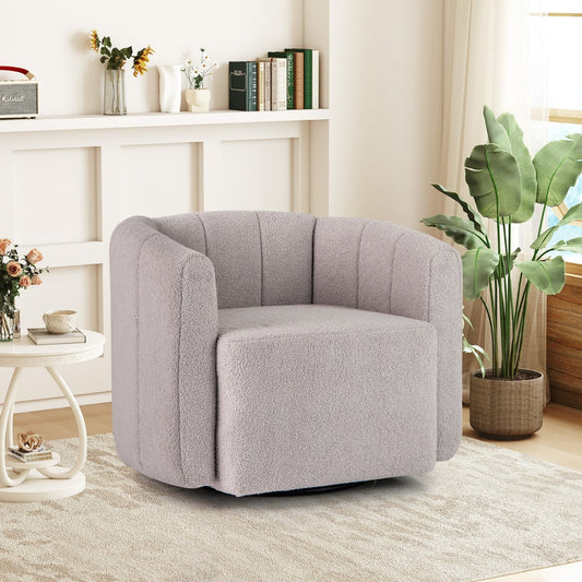 Grey upholstered swivel barrel chair in a bright living room setting