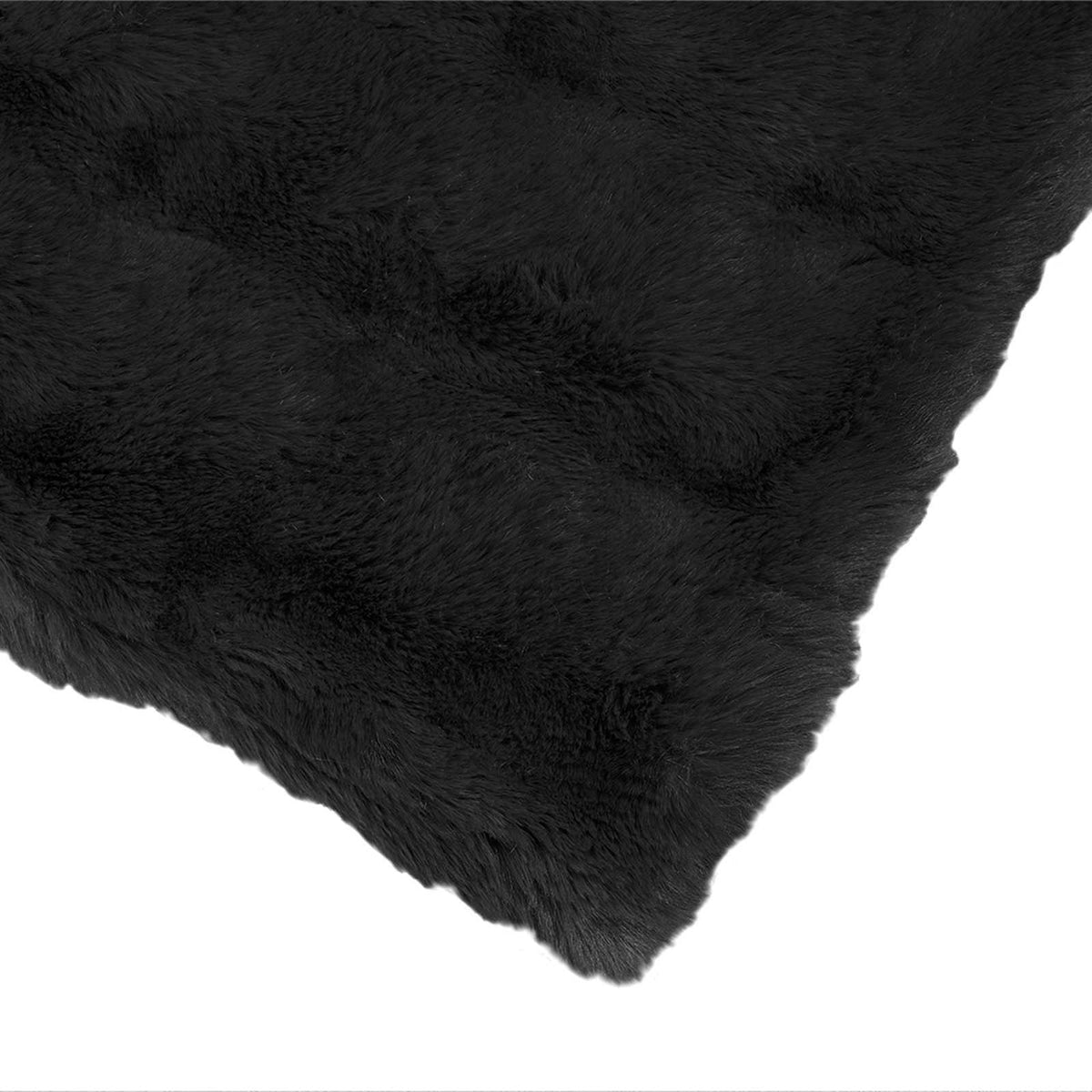 Close up of the soft faux rabbit fur texture of the black blanket
