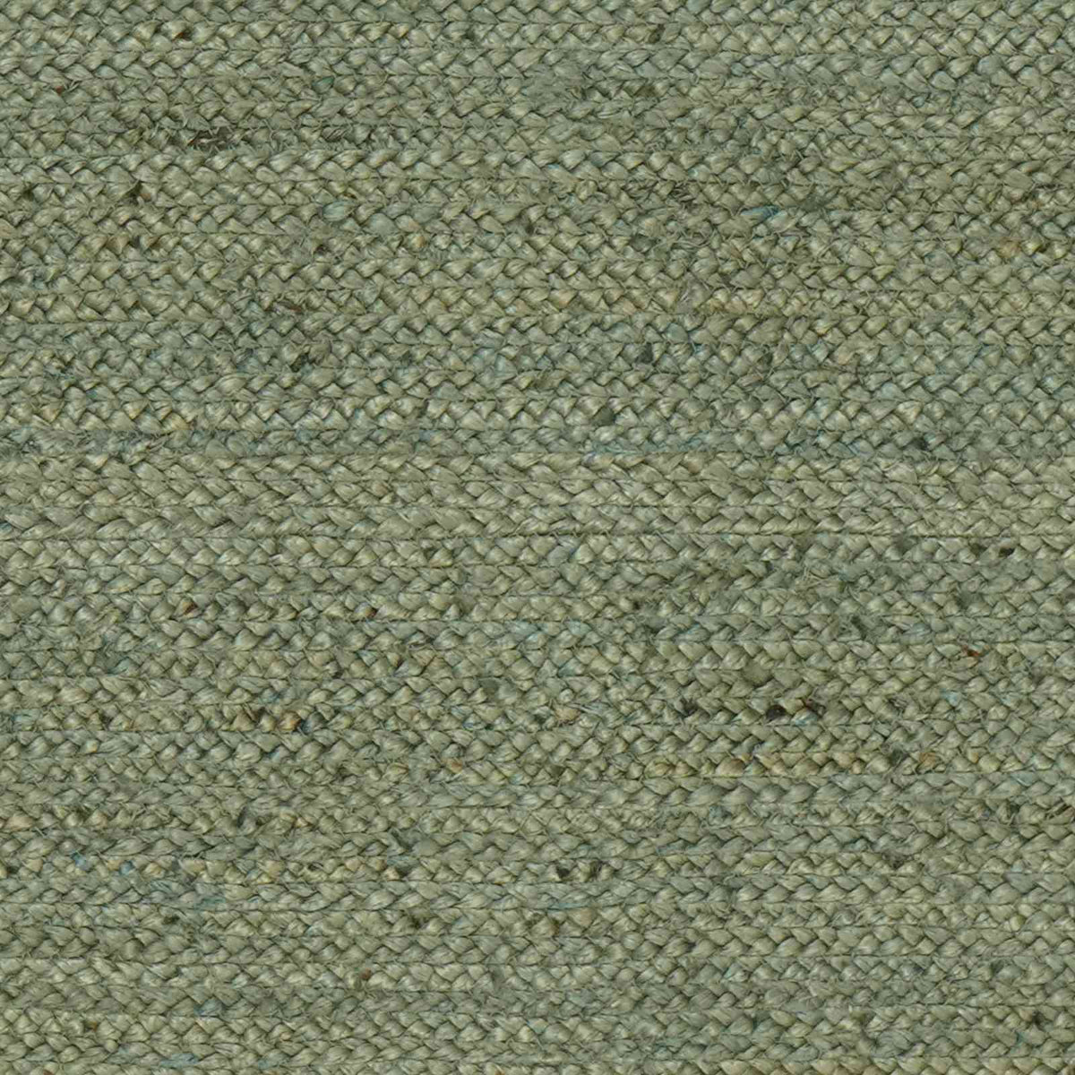 A close-up shot of the olive green rug's woven surface, showing the texture of the jute fibres
