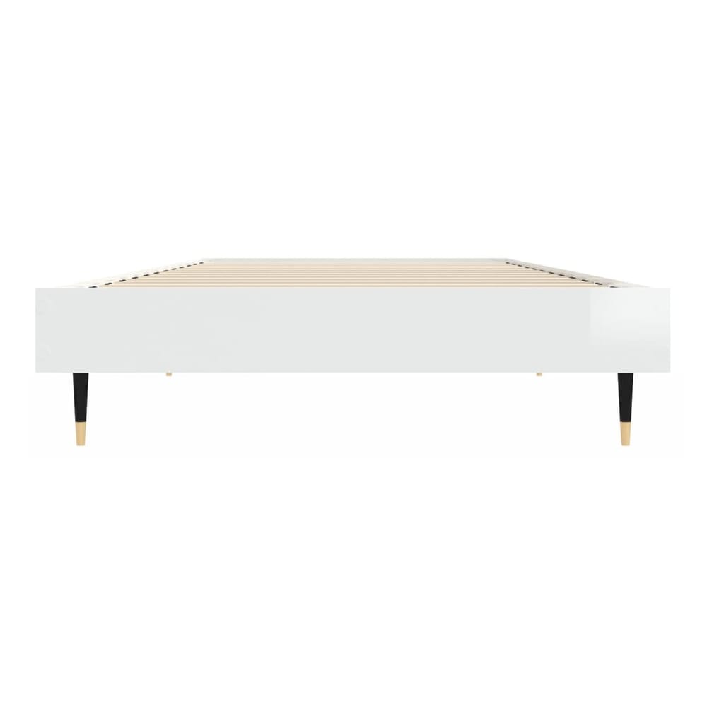 the white high gloss bed frame without mattress from a side angle showing the legs