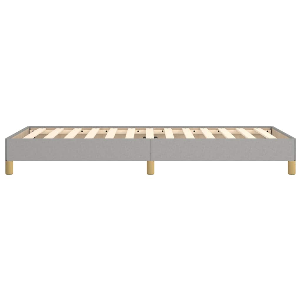 The light grey fabric bed frame without a mattress, back view