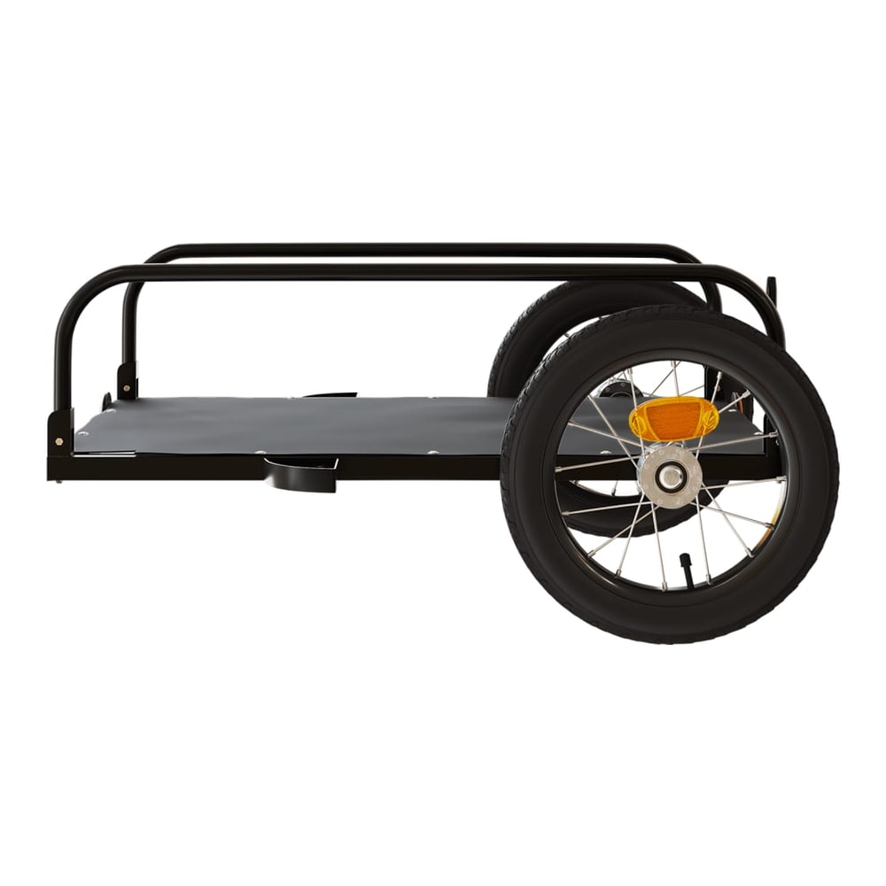 A side view of the black bicycle trailer, highlighting its wheels and cargo area