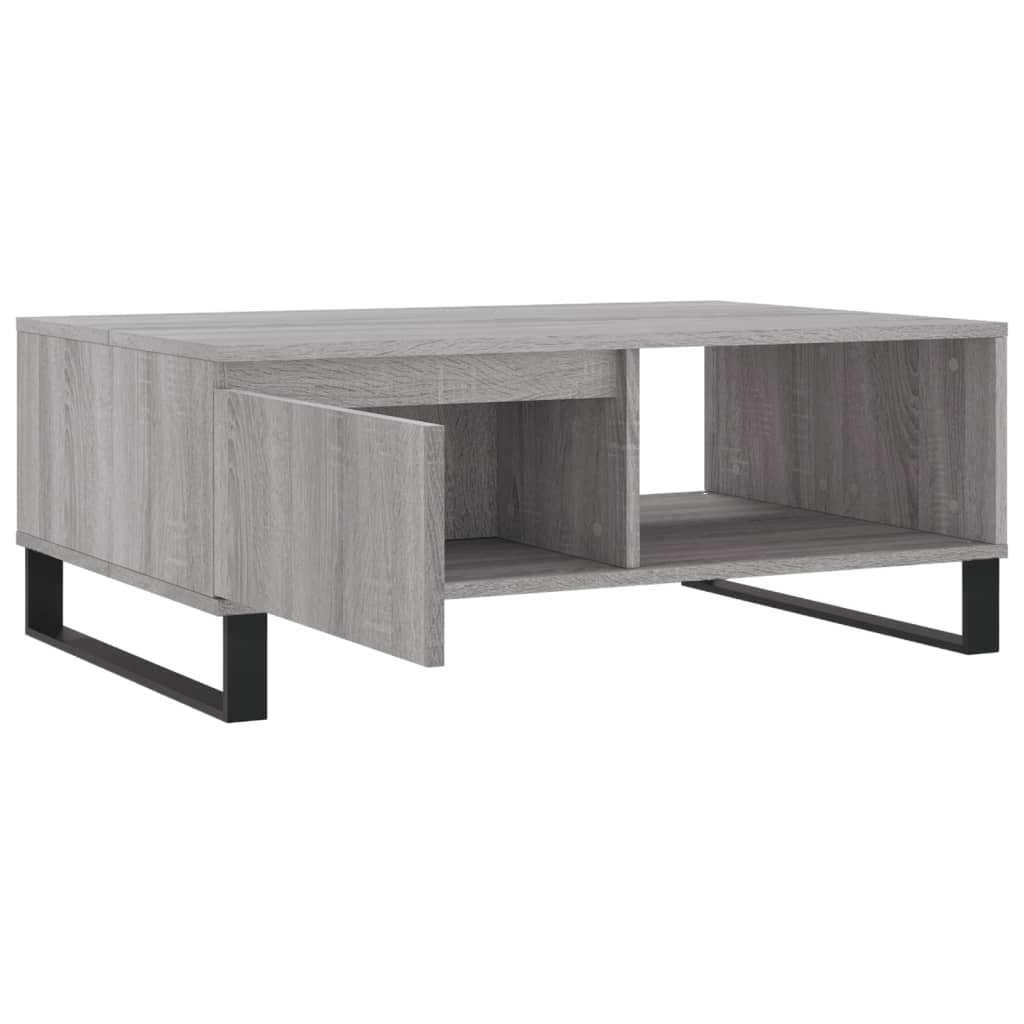 The coffee table with its drawer and compartment doors open, showing storage