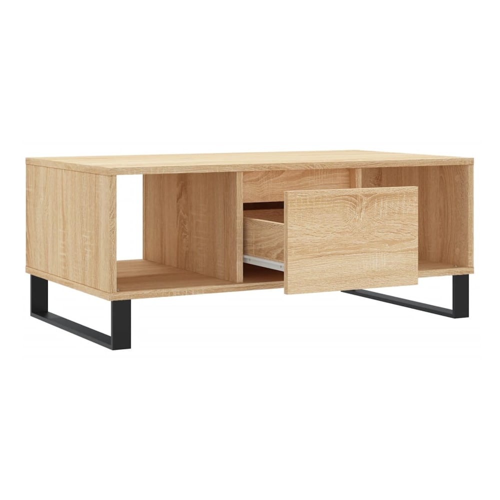 The coffee table with the drawer partially open, revealing contents