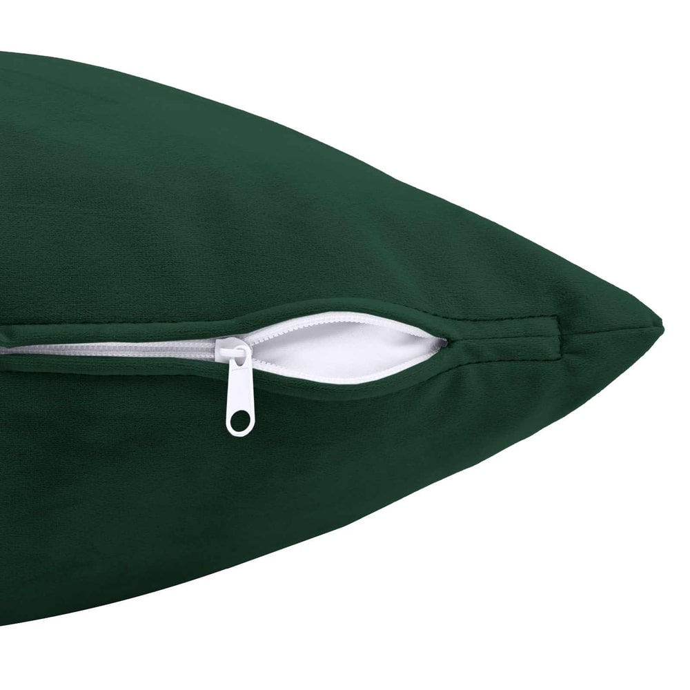 Close up of the zip on a dark green velvet cushion cover