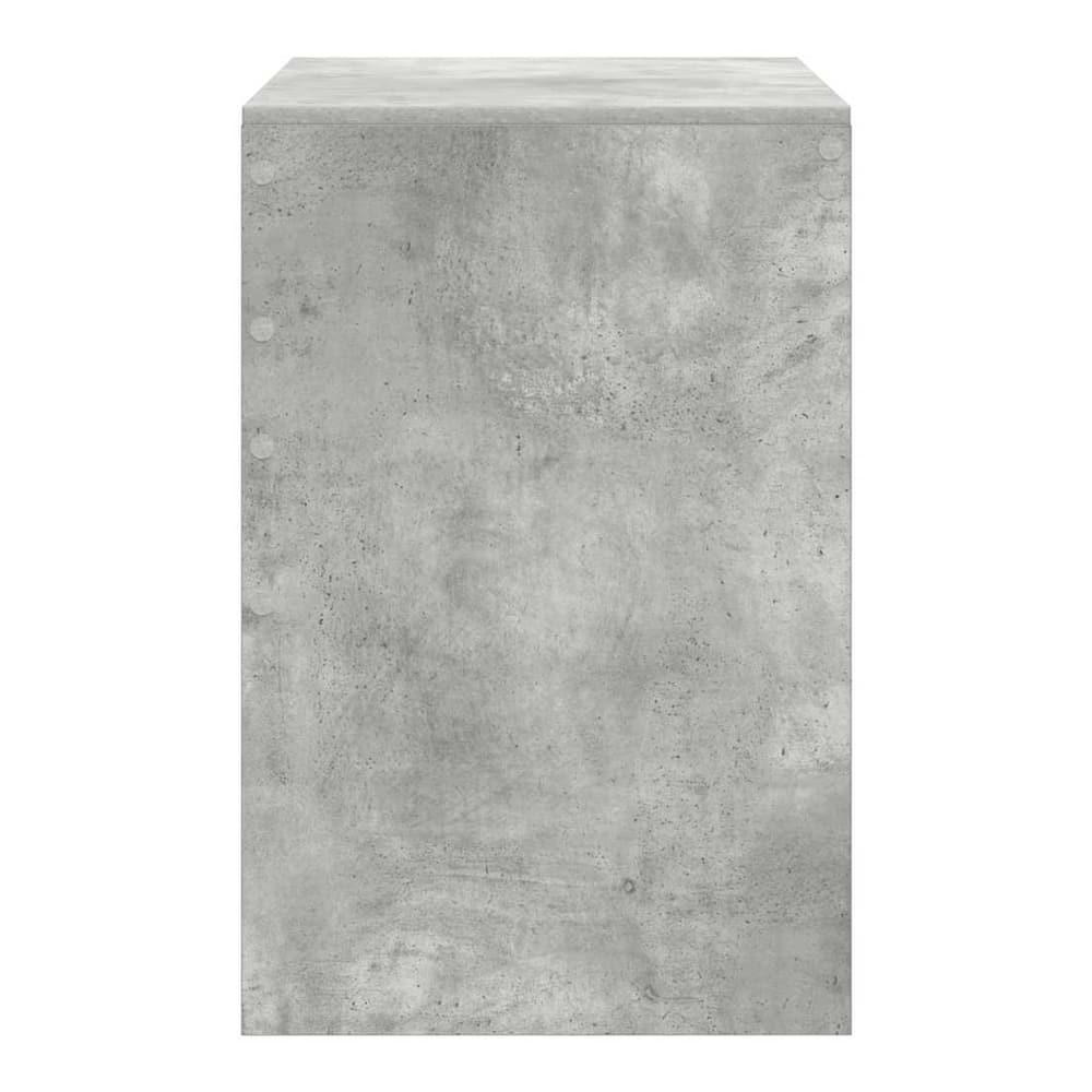 Side view of the concrete grey desk showing its textured finish